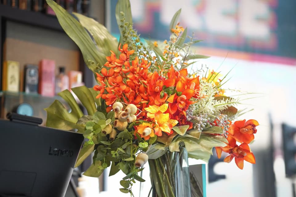 Fresh flowers on the salon counter.